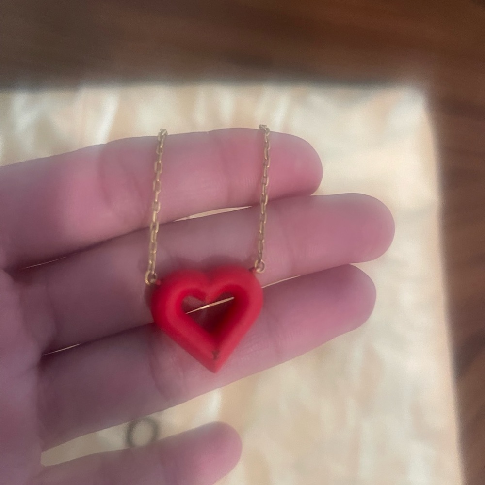 Louis Vuitton Red Heart necklace with LV stamp on heart. Very rare